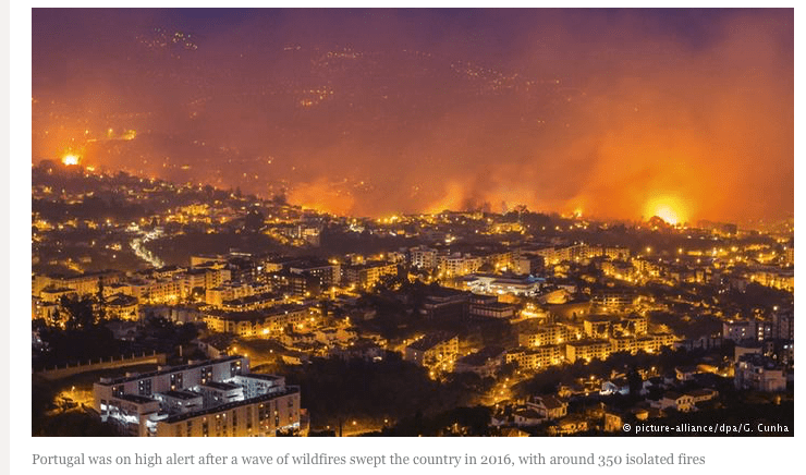 Wildfires surround a Portuguese city in 2016.