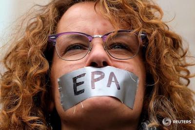 Woman with duct tape over mouth signed EPA
